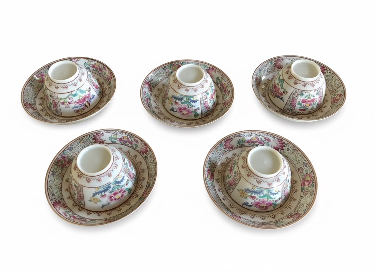 Same set of five Samson Paris cups and saucers cut out on a clean white backdrop